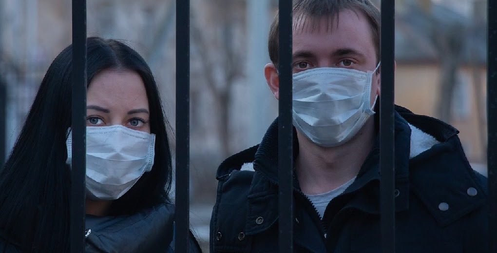 A couple wearing masks against corona virus in Prague