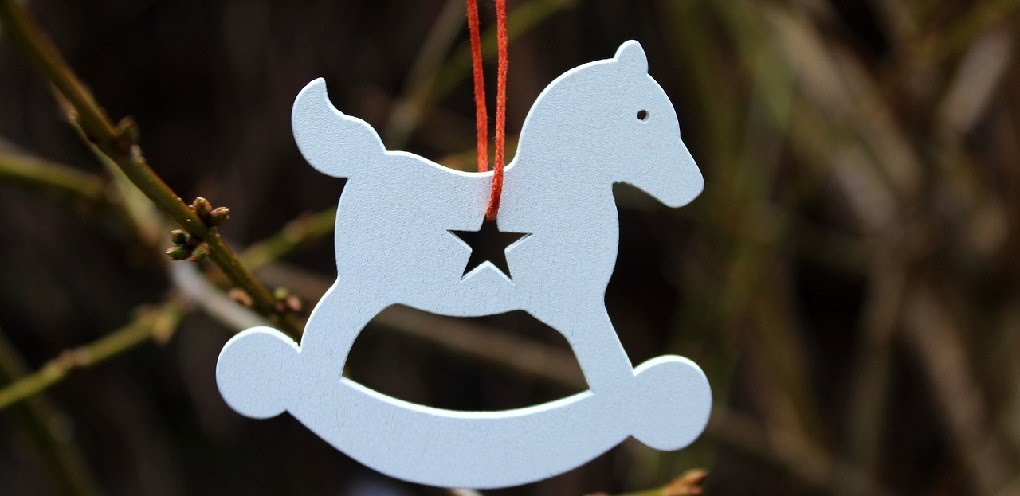 Wooden horse hanging on a string