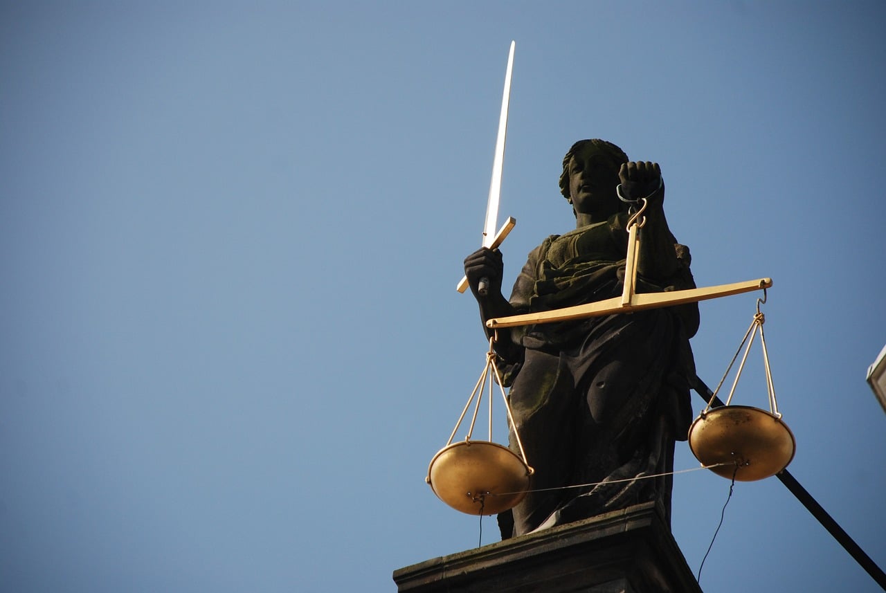 Statue of a woman holding scales