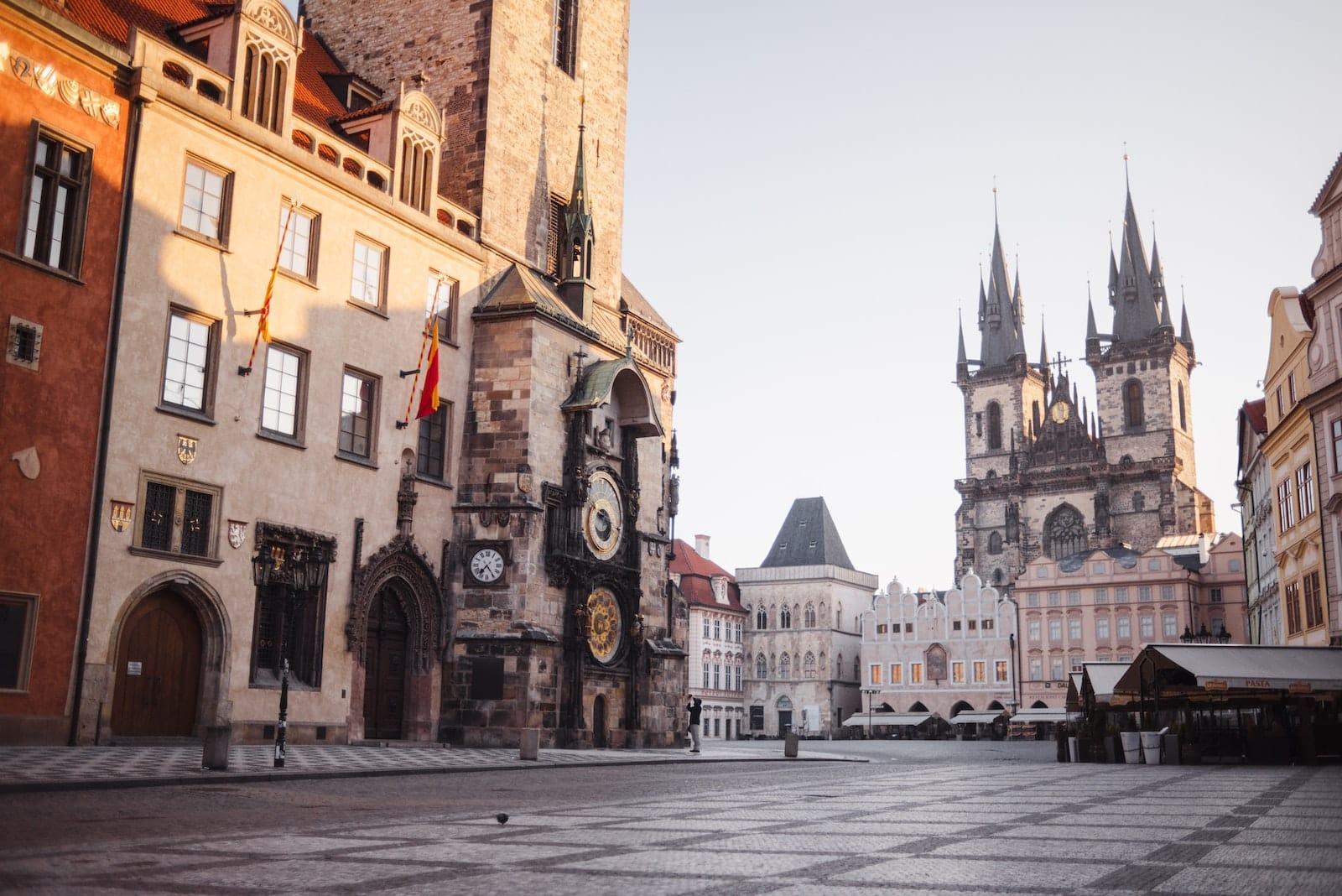 Church of Our Lady before Tyn and view of old houses on tiled floor in Prague